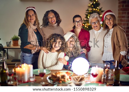 Beautiful group of women smiling happy and confident. Posing around christmas tree at home