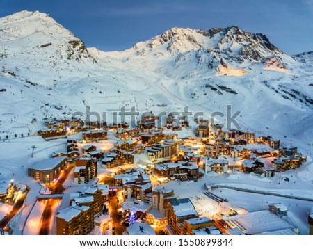Aerial drone shot dusk view of Val Thorens, ski resort in Haut Savoie, France Royalty-Free Stock Photo #1550899844