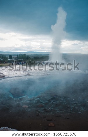 Geyser valley whith hot springs with thermal water erupt in the Haukadalur valley. Strokkur Geysir geyser on the south west Iceland. 