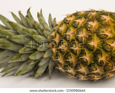 Single whole pineapple isolated on white background. Fresh tasty pineapple.