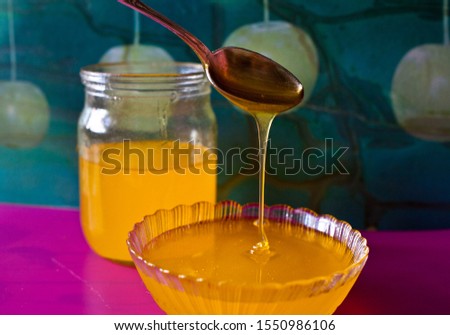 Fresh golden colored honey on the kitchen table