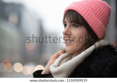 Close up portrait of young woman on Brivibas street in city Riga, Latvia