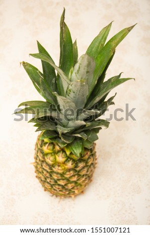 One whole pineapple, a ripe, fresh tropical fruit, 
