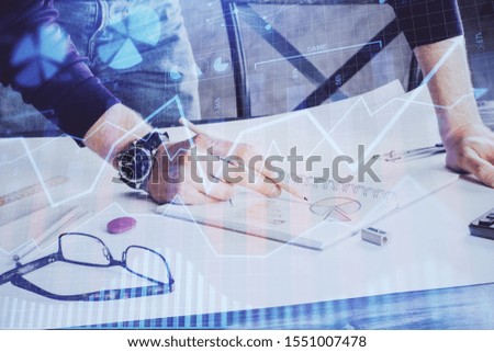 Financial trading chart double exposure with man desktop background.