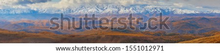 Autumn picturesque panoramic view of the North Chuya ridge. Panorama of serene tranquil mountain range of Altai mountains in morning, Gorny Altai (Altai republic), Siberia, Russia