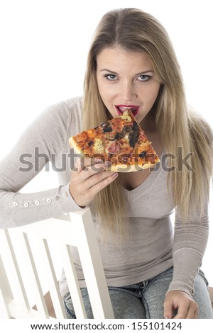 Model Released. Attractive Young Woman Eating Pizza