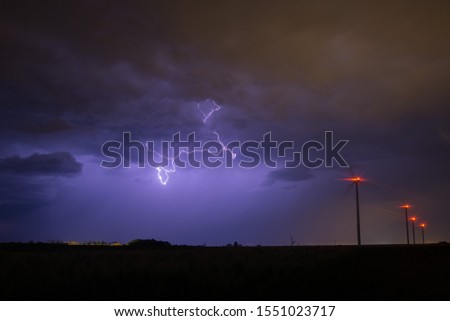 lightning strik over a wind farm (intercloud form)