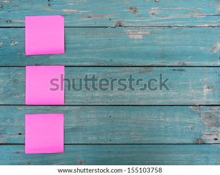 Note paper stick on wood background