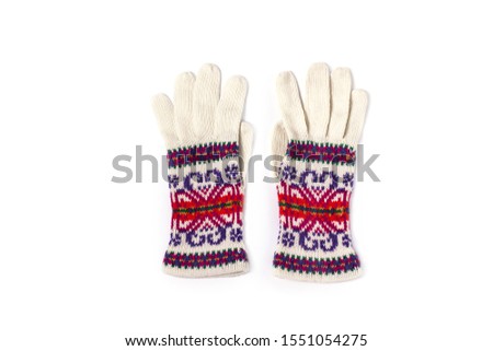 Warm colorful woolen knitted gloves isolated on a white background. Winter flatlay, top view, mockup for brand name, copy space. Shopping concept. Autumn and winter clothes, shopping sales.