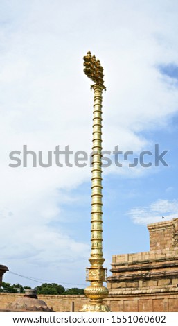 "40ft high Brass plated Flag post (Dwaja sthambha) found at the entrance of Great Brihadisvara temple of Lord Shiva in Gangaikonda Cholapuram, Tamilnadu, South India"