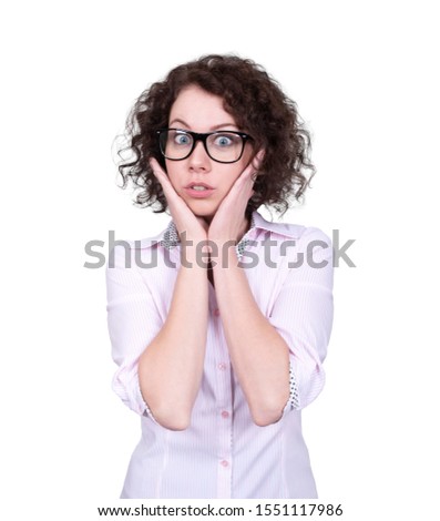 Cute surprised girl with curly hair. Office style, business glasses.