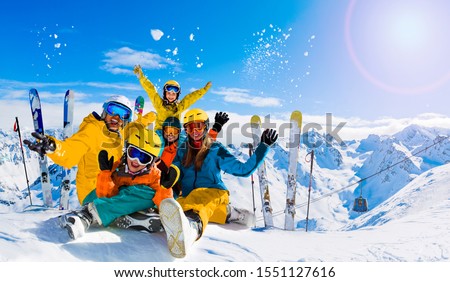 Ski in winter season, mountains and ski family on the top in sunny day in France, Alps above the clouds.
 Royalty-Free Stock Photo #1551127616