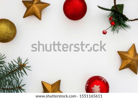 Creative Composition Useful for Christmas and New Year Greeting Card Created Using Decorative Balls, Green Pine Branches and Decorative Stars. Copy Space in The Middle
