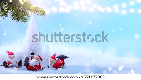 Art Christmas Holiday Background with Christmas Tree decoration on light blue background;  greeting banner backdrop picture