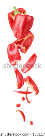 Sweet red pepper sliced and falling isolated on a white background