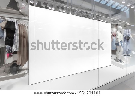 Mockup of blank white horizontal indoor advertising billboard at the storefront window in shopping centre or mall