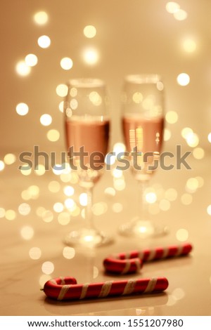 Glass of champagne on blur lights background