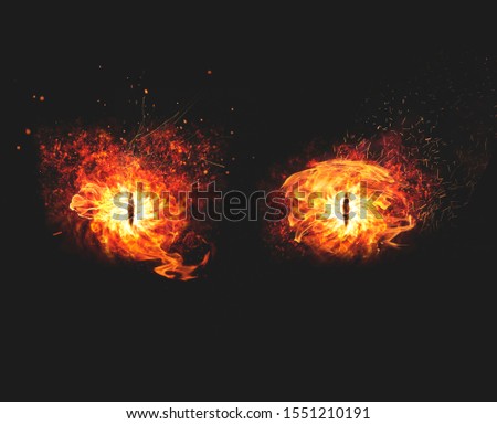 Blazing flames of fire for a demon eyes artwork on dark background Royalty-Free Stock Photo #1551210191