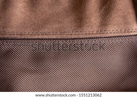 closeup of brown backpack texture, sewing leather and fabric