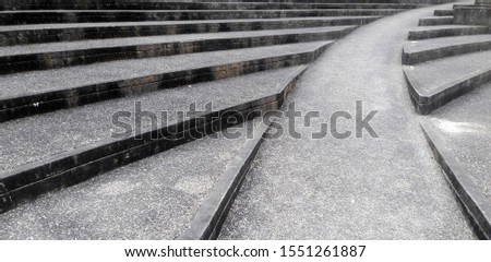 Wheelchair-specific step walkways, city park stairs, granite monuments and landmarks, located on wide stone steps, wide steps