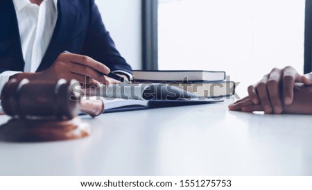 Justice lawyer meeting with contract papers and Judge gavel on tabel in courtroom. Attorney working in courtroom. Justice and law, attorney, court judge concept.


