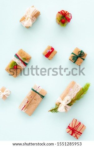 Christmas presents decorating in Scandinavian style on light blue background, top view
