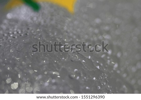 Water droplets melting from freezing cold bottle.
