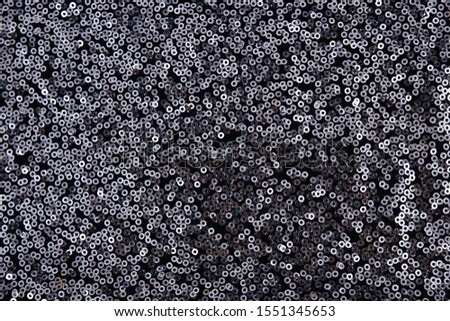 Texture of gray pearlescent sequins, macro photo
