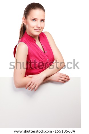 A smiling woman standing near blank, isolated on white background