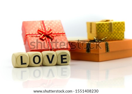 Love text wooden blocks with rose and gift box,Lover concept.