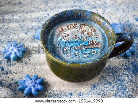 Blue drink with zodiac signs inside