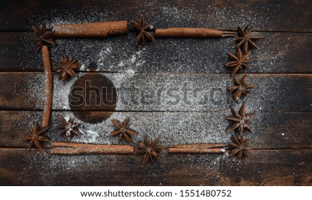 cinnamon stick frame stars star anise icing sugar for Christmas decor