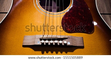 acoustic guitar on the wood board background