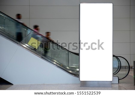 Vertical bank billboard indoors of metro or airport hall, advertising mock up, public information board. Blur Background. 