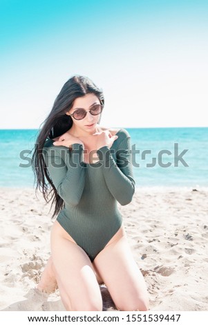 Girl sitting on the seashore