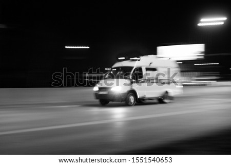 Ambulance is rushing to a call to a sick call Royalty-Free Stock Photo #1551540653
