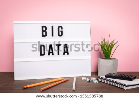 Big Data. Information technology, service delivery, quality and speed. White lightbox on a wooden table