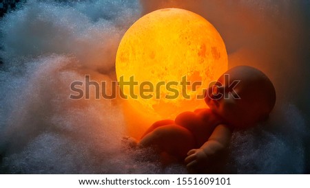 Baby born child sleeping on white cloud and full moon. For sleeping music, baby shower, story idea.