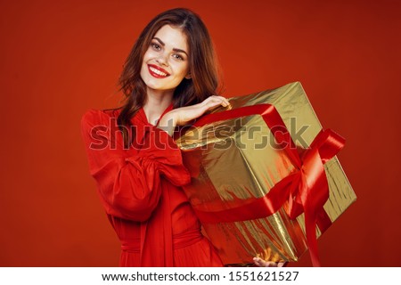 Gift box with red bow and happy woman smile make up