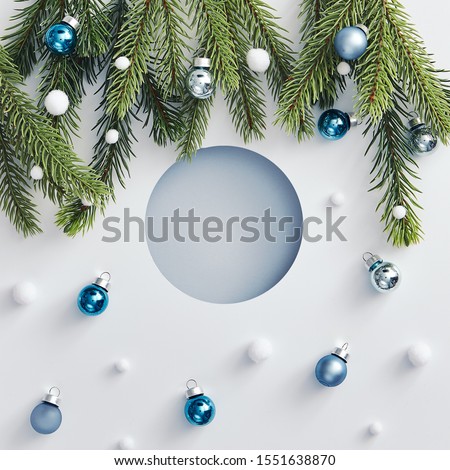 Christmas minimal concept - creative abstract christmas bauble made of xmas balls and tree branch. Minimal xmas pattern. Hipster winter greeting card. Winter holiday symbol. Christmas holiday pattern.