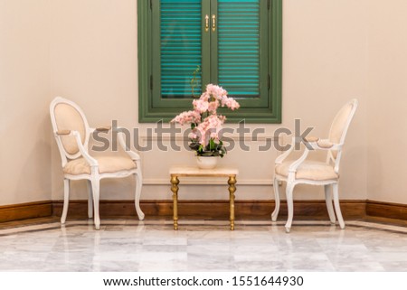 Antique living room set and green widow with flower in vase decoration concept interior