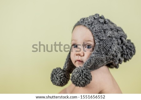 A child in a woolen hat. Suitable for music stores, music products, articles and advertising, schools and development clubs.