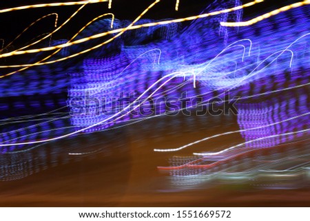 Blurred christmas lights, abstract background with lines of light.
