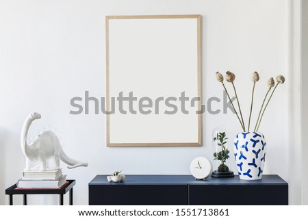 Stylish scandinavian living room with mock up poster frame,  navy blue commode, table lamp and elegant accessories. Modern home decor. Interior design. Template Ready to use. 