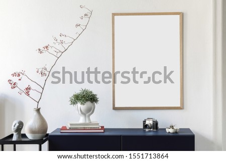 Stylish scandinavian living room with mock up poster frame,  navy blue commode, plants, flowers in vase and elegant accessories. Modern home decor. Interior design. Template Ready to use. 
