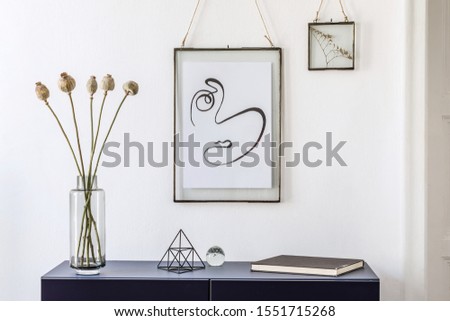 Stylish scandinavian living room with mock up poster frame, navy blue commode, table lamp and elegant accessories. Modern home decor. Interior design. Template Ready to use. 