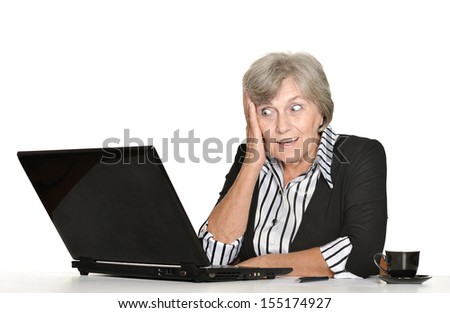 Old woman with a laptop on a white background