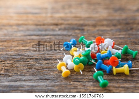 Selective focus of Colorful Many pins on wood background and copy space