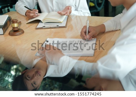 businessman consulting lawyer & signing contract agreement. team meeting at law firm