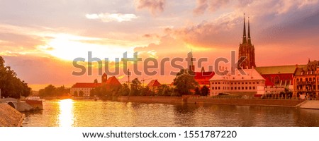 Wroclaw, Poland sunset panoramic banner with Ostrow Tumski island, Odra or Oder river and cathedral towers